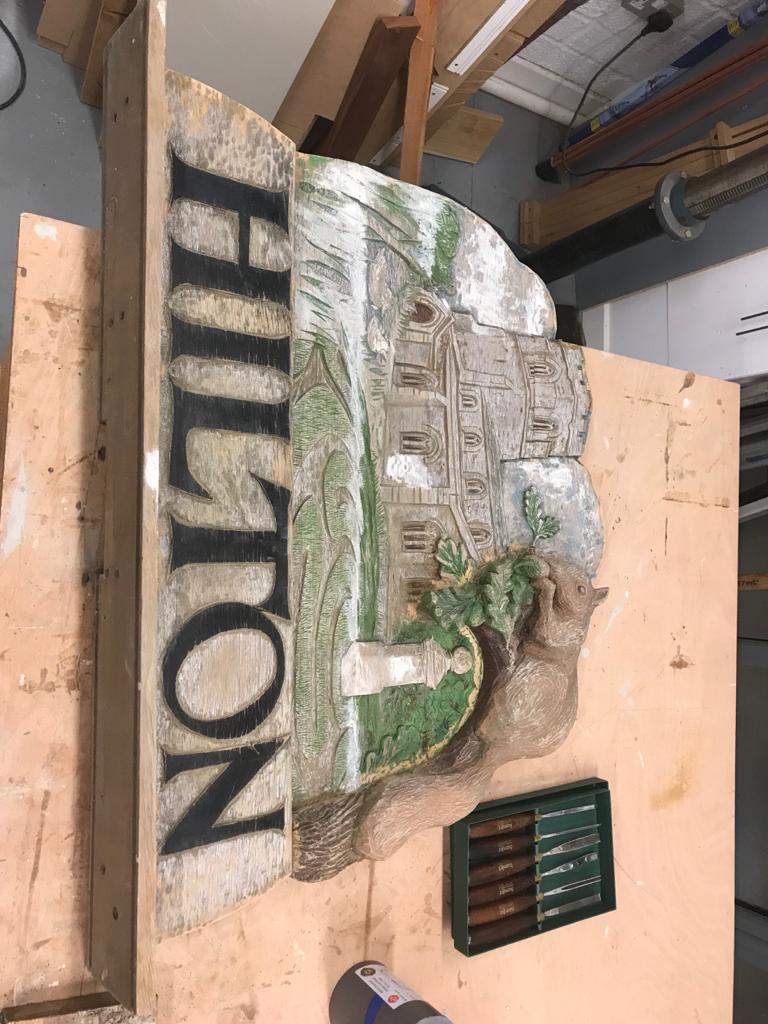 The reassembled village sign ready to be painted